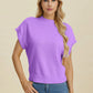 Woman wearing a lavender Double Take Full Size Mock Neck Short Sleeve Sweater with jeans against neutral background