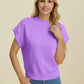 Woman wearing a lavender Double Take Full Size Mock Neck Short Sleeve Sweater with ribbed edges and casual fit.