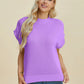 Woman wearing lavender Double Take Full Size Mock Neck Short Sleeve Sweater with ribbed collar and hem, paired with jeans