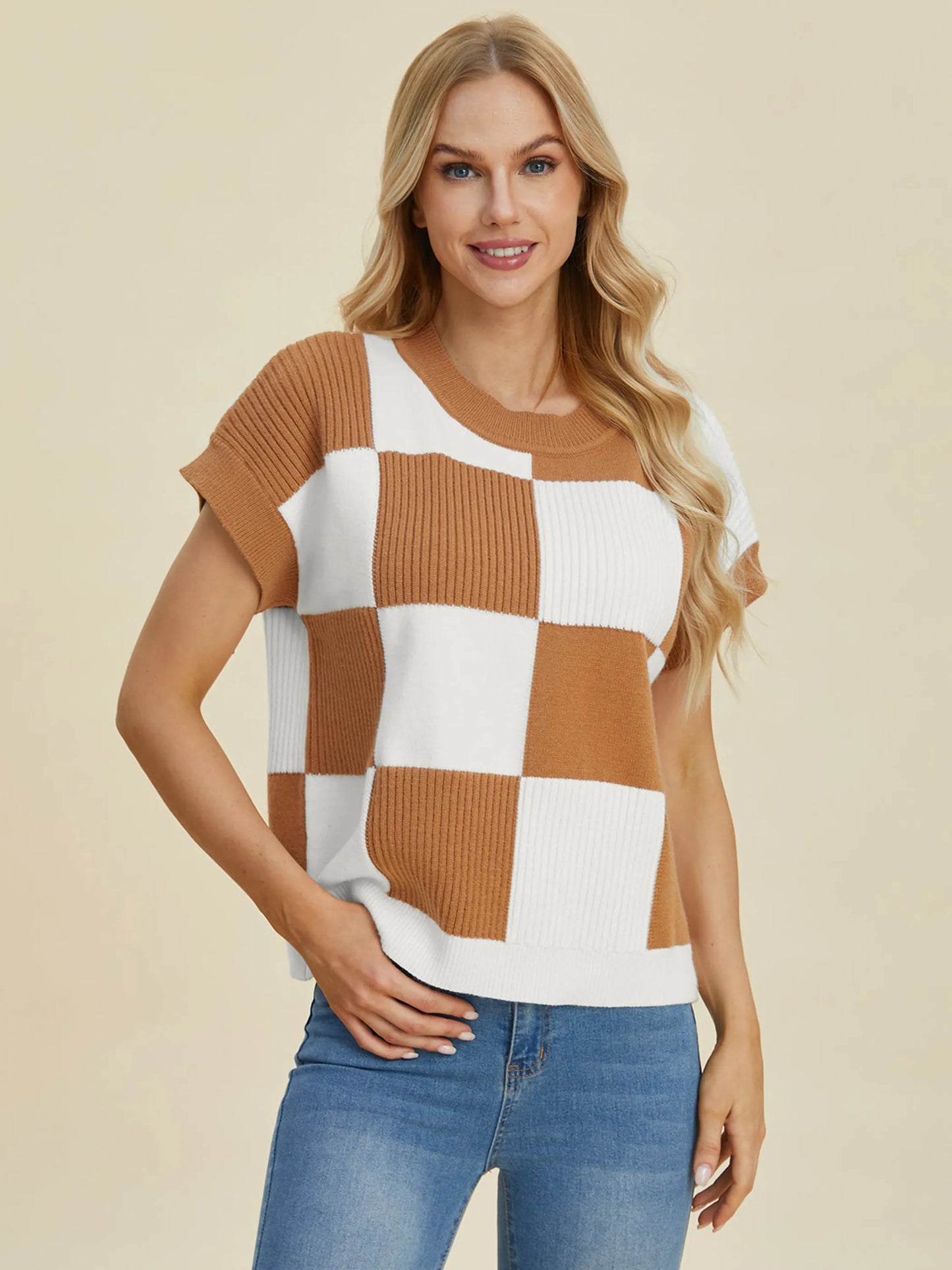 Woman wearing Double Take Full Size Checkered Round Neck Short Sleeve Sweater in brown and white checkered pattern.