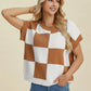 Woman wearing Double Take Full Size Checkered Round Neck Short Sleeve Sweater in brown and white, smiling with hand behind head
