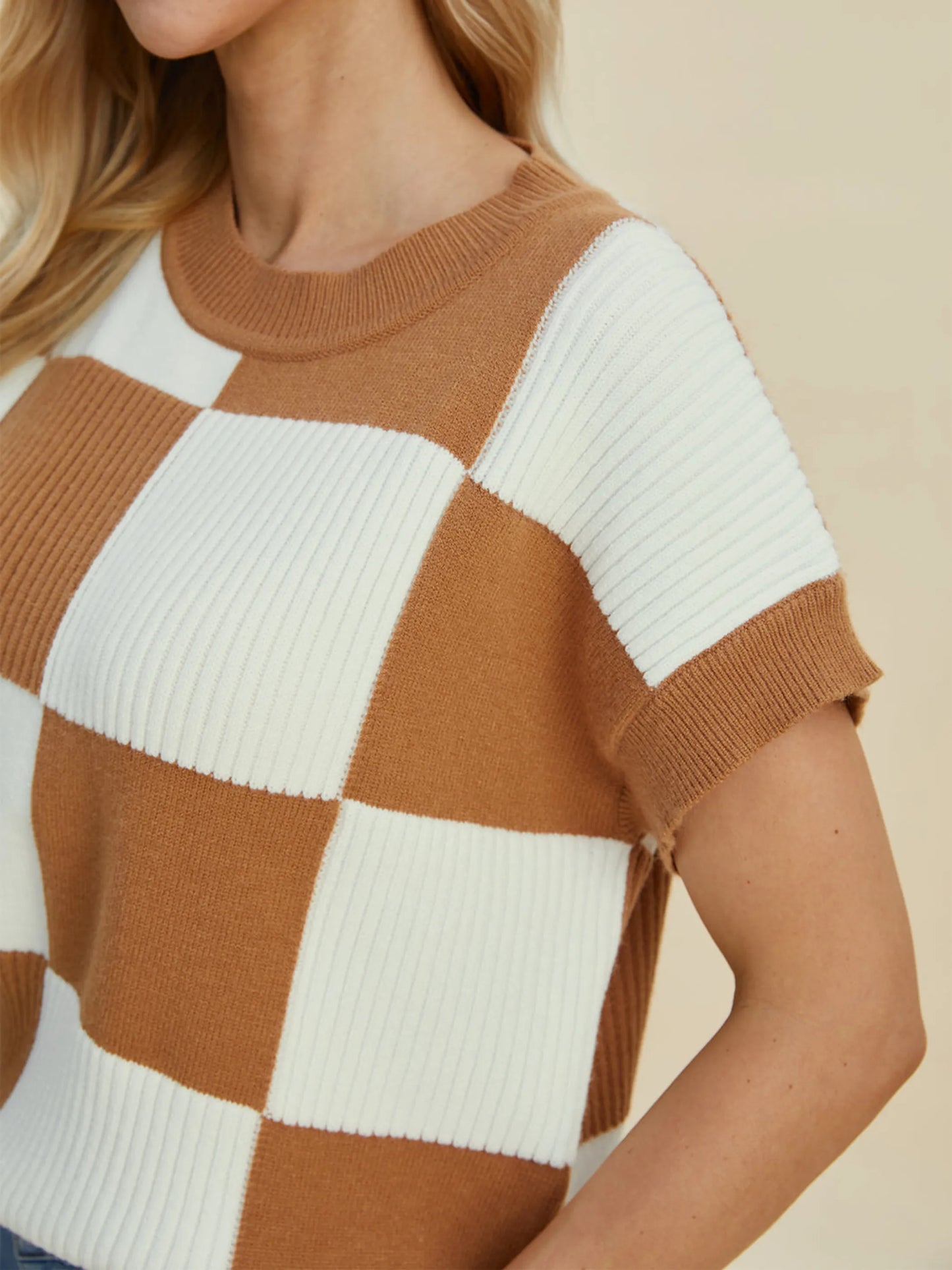 Double Take Full Size Checkered Round Neck Short Sleeve Sweater in brown and white ribbed knit pattern on model