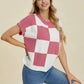 Woman wearing a pink and white checkered Double Take Full Size Checkered Round Neck Short Sleeve Sweater.