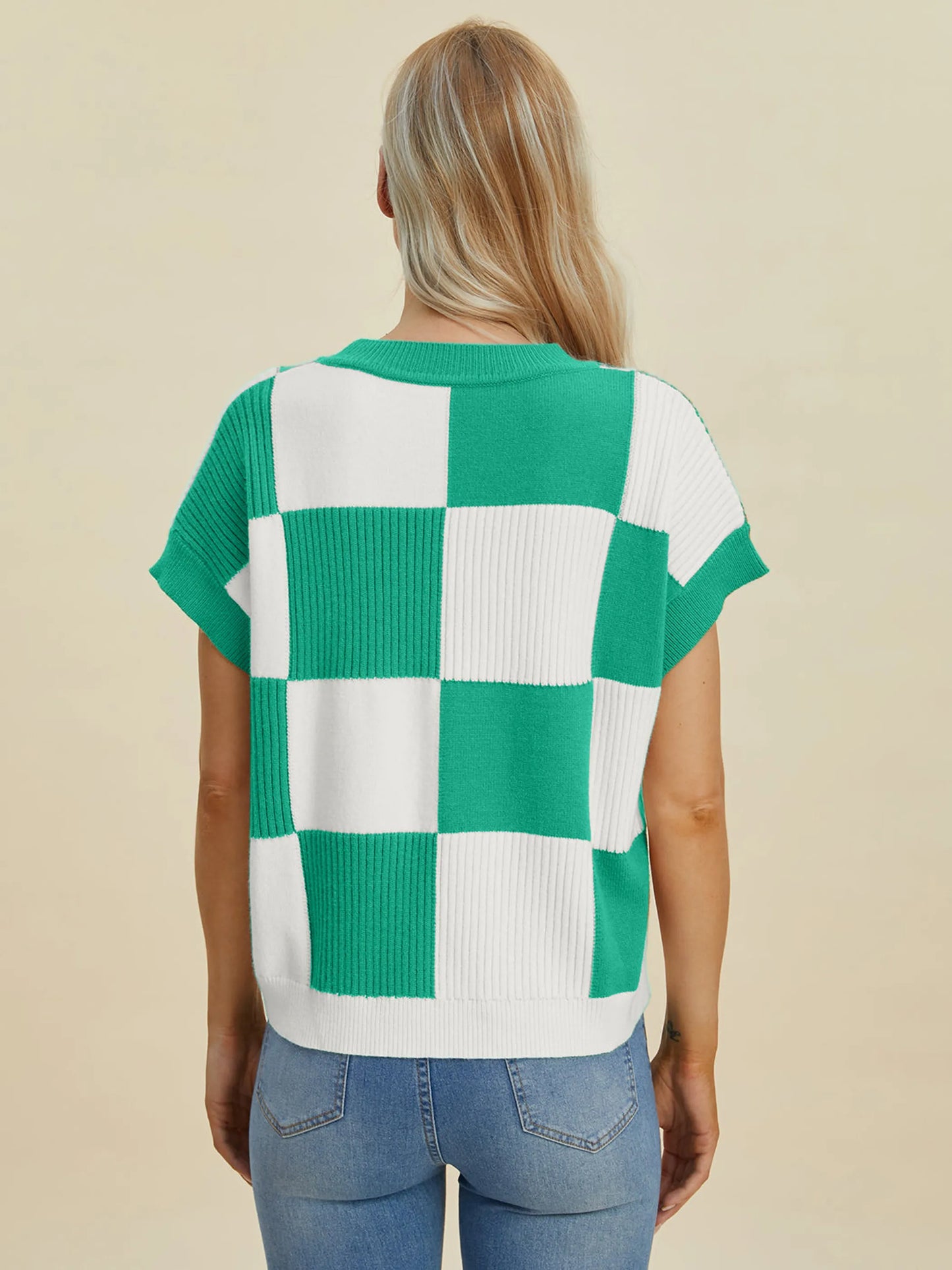 Woman wearing Double Take Full Size Checkered Round Neck Short Sleeve Sweater in green and white checkered pattern viewed from back