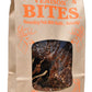 Brown paper bag of Dr. Becker's Venison Bites Freeze-Dried Dog Treats 5oz with orange text and window showing treats inside