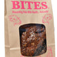 Dr. Becker's LAMB Bites Freeze-Dried Grass-Fed Lamb Dog Treats in a brown paper bag with red text and window showing treats.
