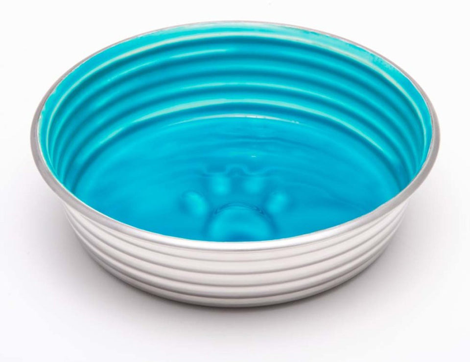 Ribbed steel dog bowl with teal blue interior and embossed paw print