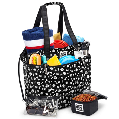 Mobile Dog Gear Dogssentials Tote Bag with paw print design filled with dog accessories and travel essentials.