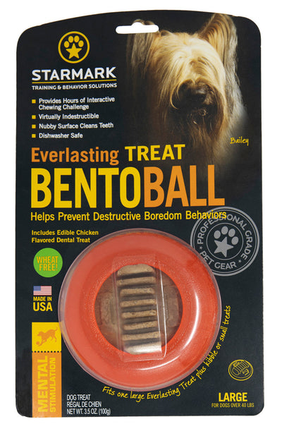 Starmark Everlasting Treat Bento Ball dog toy, orange with a treat inside, on black packaging with a dog's face.