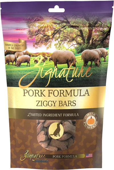 Purple and brown Zignature dog treat bag with pigs in a field, featuring "Pork Formula Ziggy Bars" and a pumpkin.
